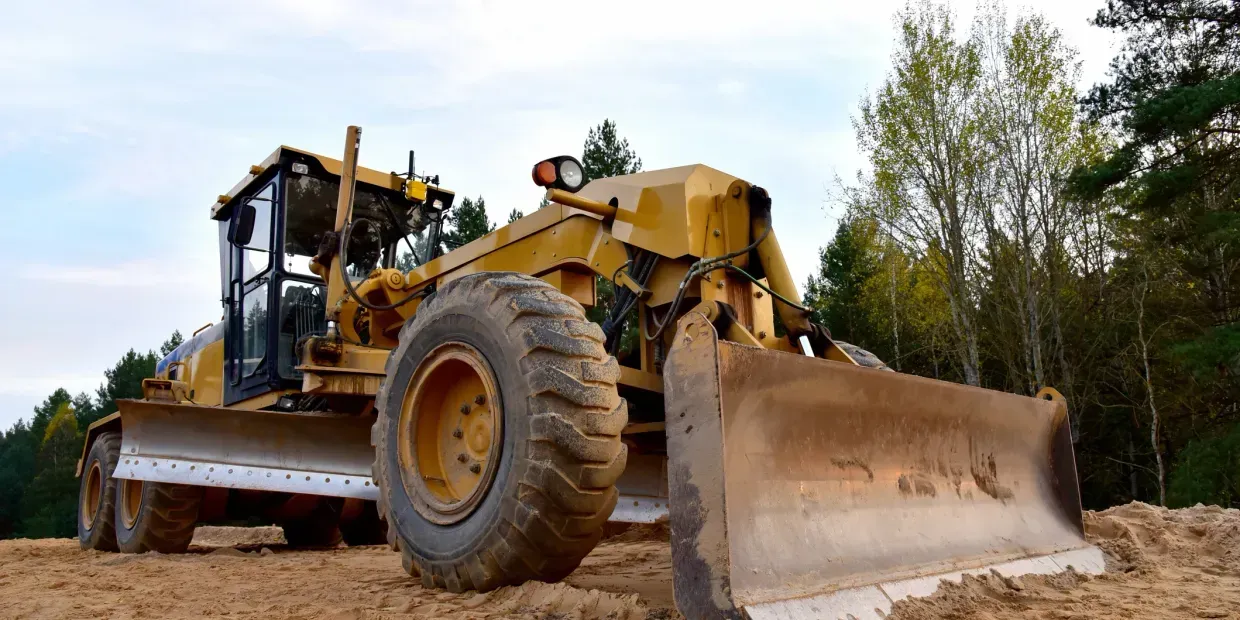 A grader working a site for TAM Civil